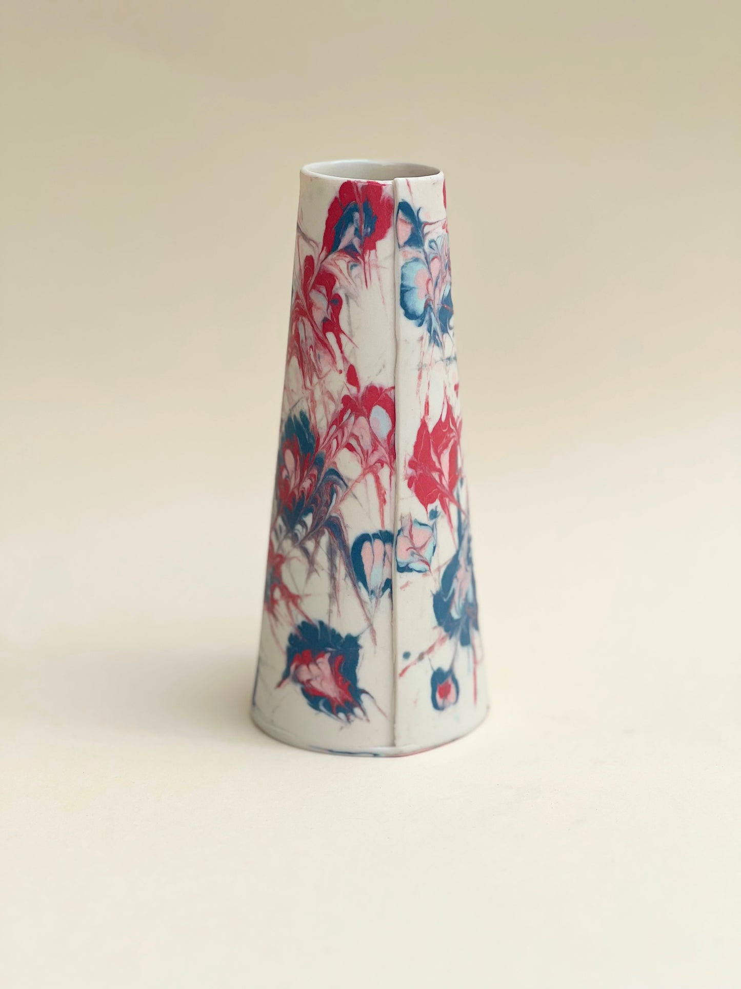 Conical vases - splash colors red, blue, pink on white background