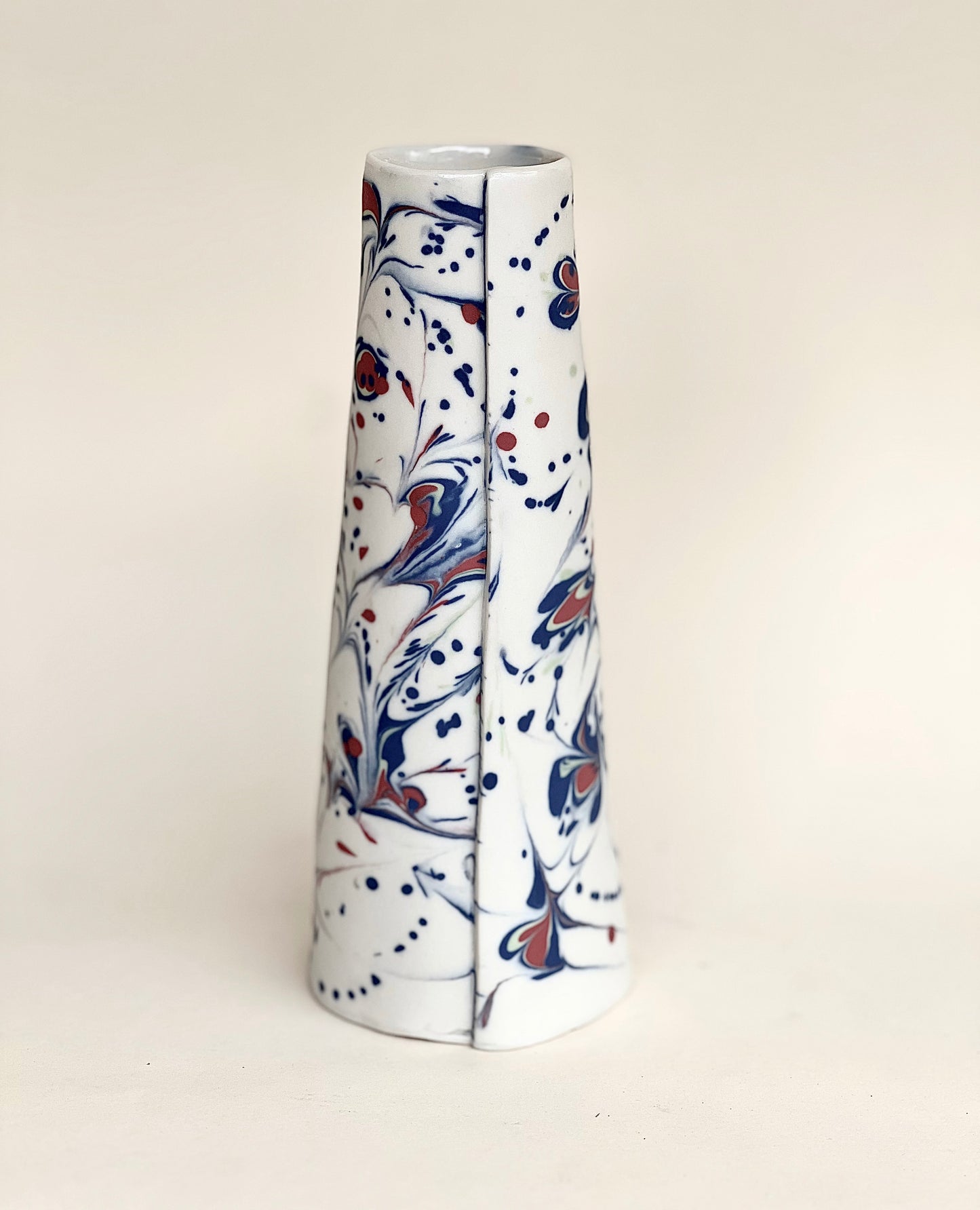 Conical vase - splash colors red, blue, pale green on white background