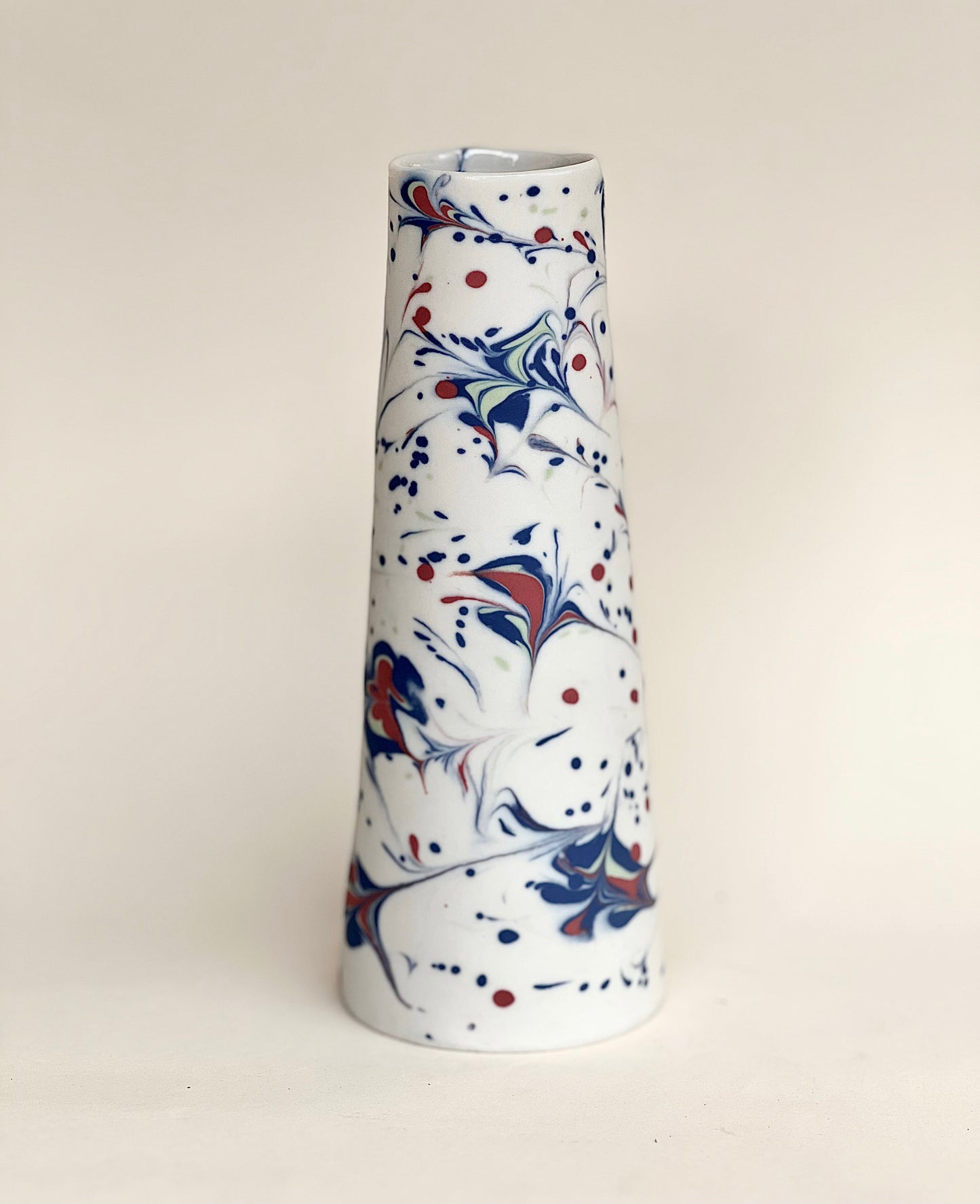 Conical vase - splash colors red, blue, pale green on white background
