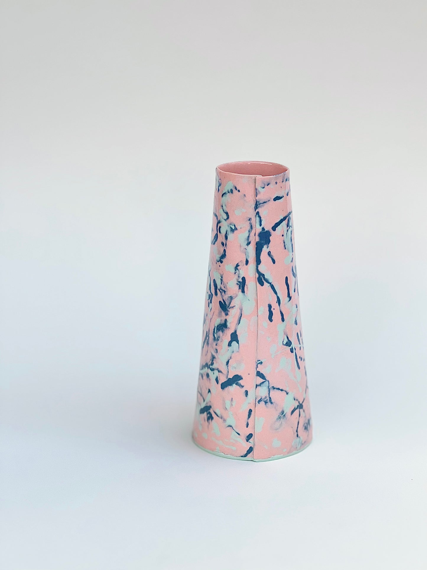 Conical vases - colored drops  pale green, dark green on pink background