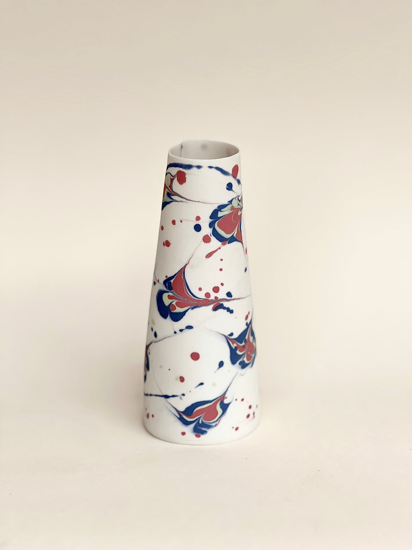 conical vase - splash colors blurred,pale green on white background