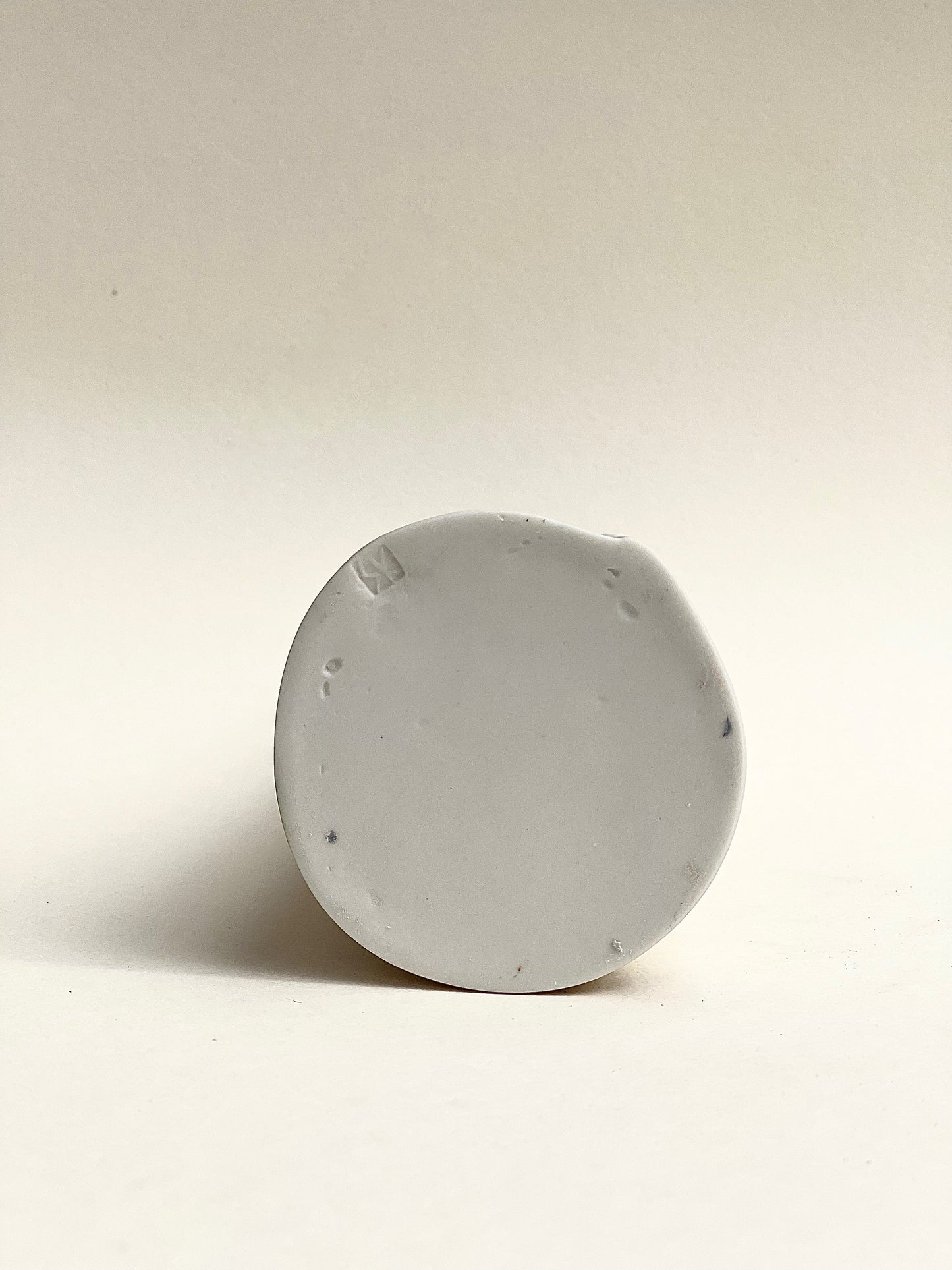 Conical vase - colored circles blurred,pale green on white background