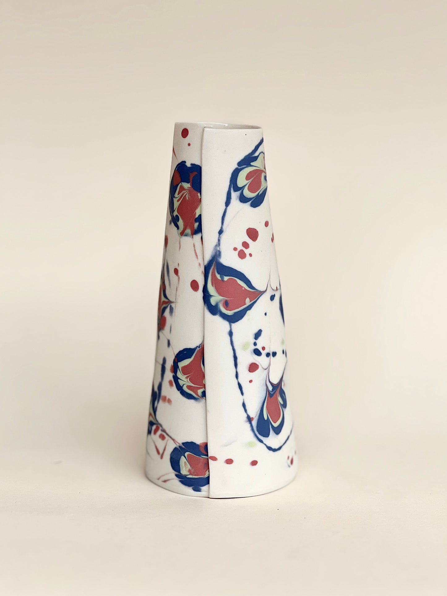 conical vase - splash colors blurred,pale green on white background