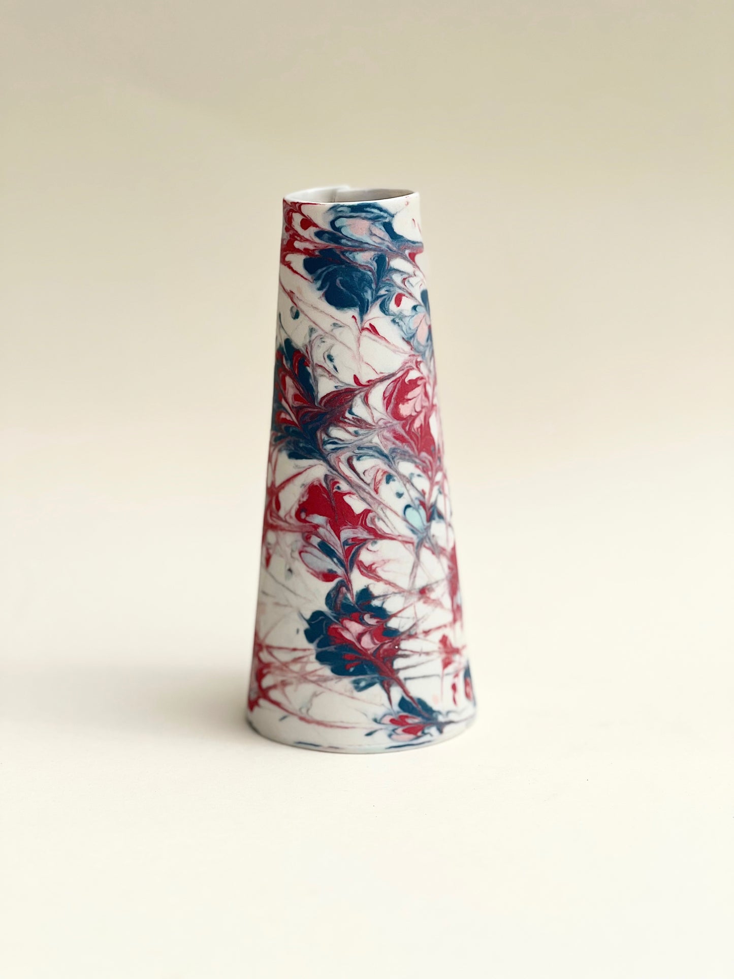 Conical vases - splash colors red, blue, pink on white background