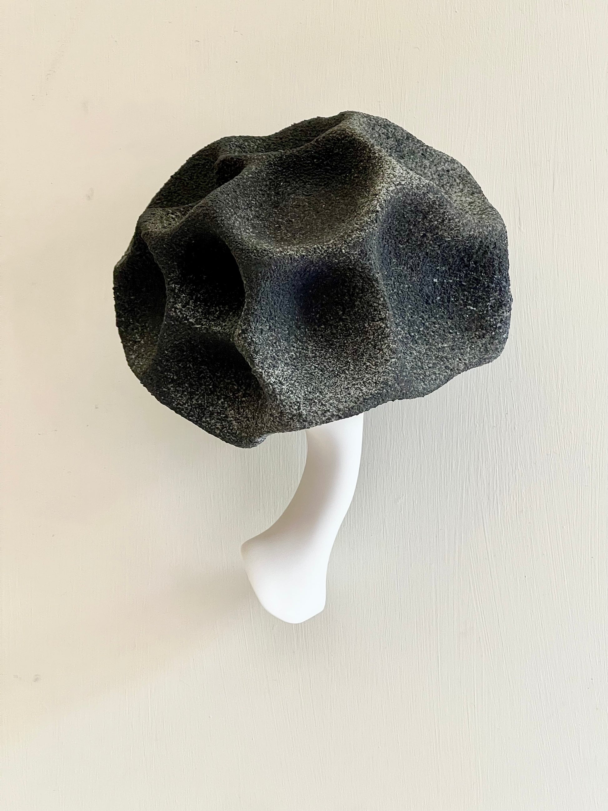 Top view of Crazy Wallflower — Black Spore, showing the irregular textured surface, raised forms and recessed areas in black and white porcelain.
