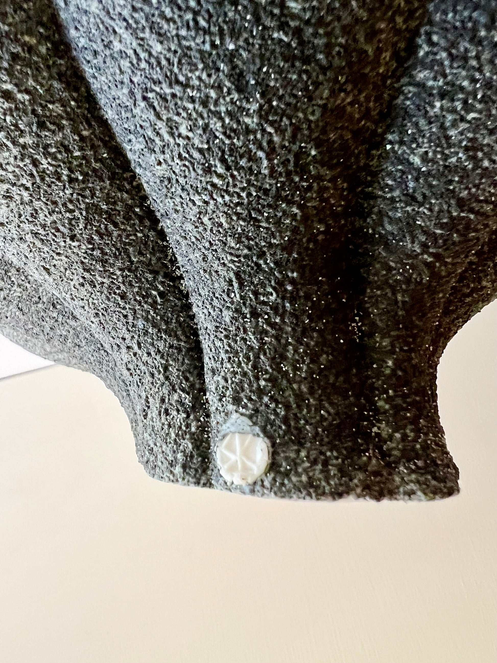 Detail of the artist stamp on the back of Crazy Wallflower — Pollen porcelain wall sculpture