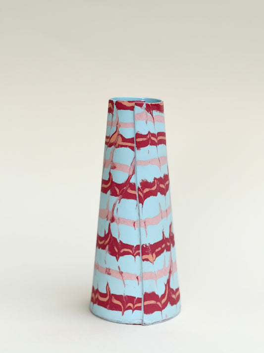 Conical vases - red and pink on pale blue background