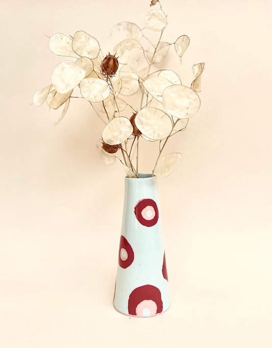 Conical vase - colored circles red pink on pale blue background
