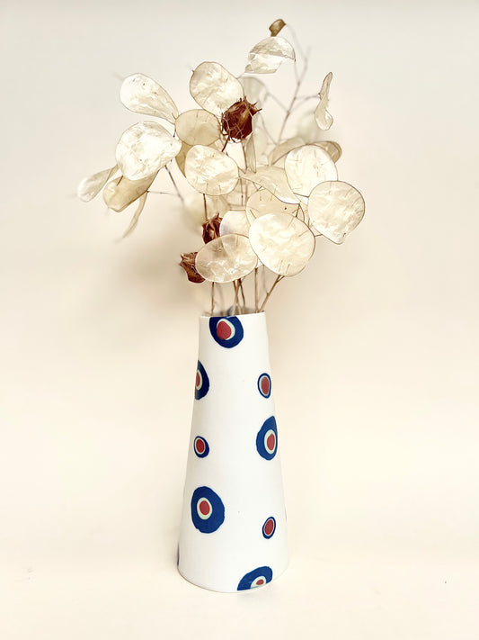 Conical vase - colored circles blurred,pale green on white background