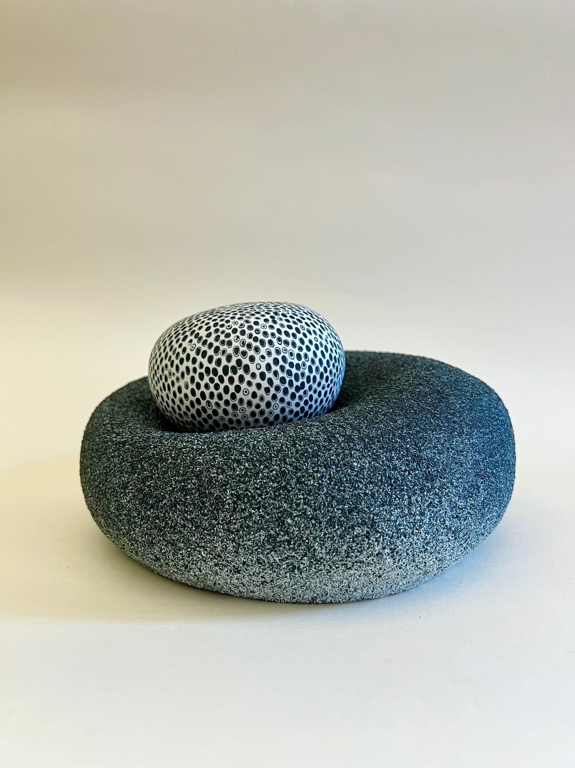 Organic Shape porcelain sculpture with removable patterned sphere and sculptural textured base.