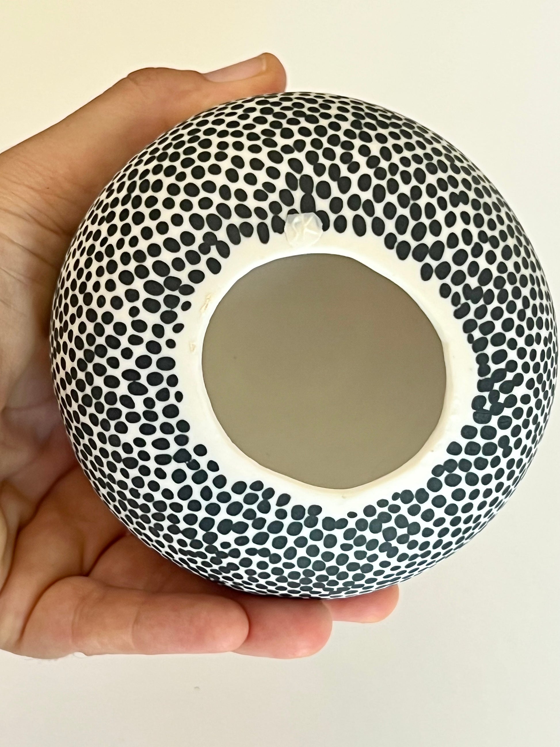 Bottom view of Pulse I porcelain sculpture showing the artist's stamp on the underside.
