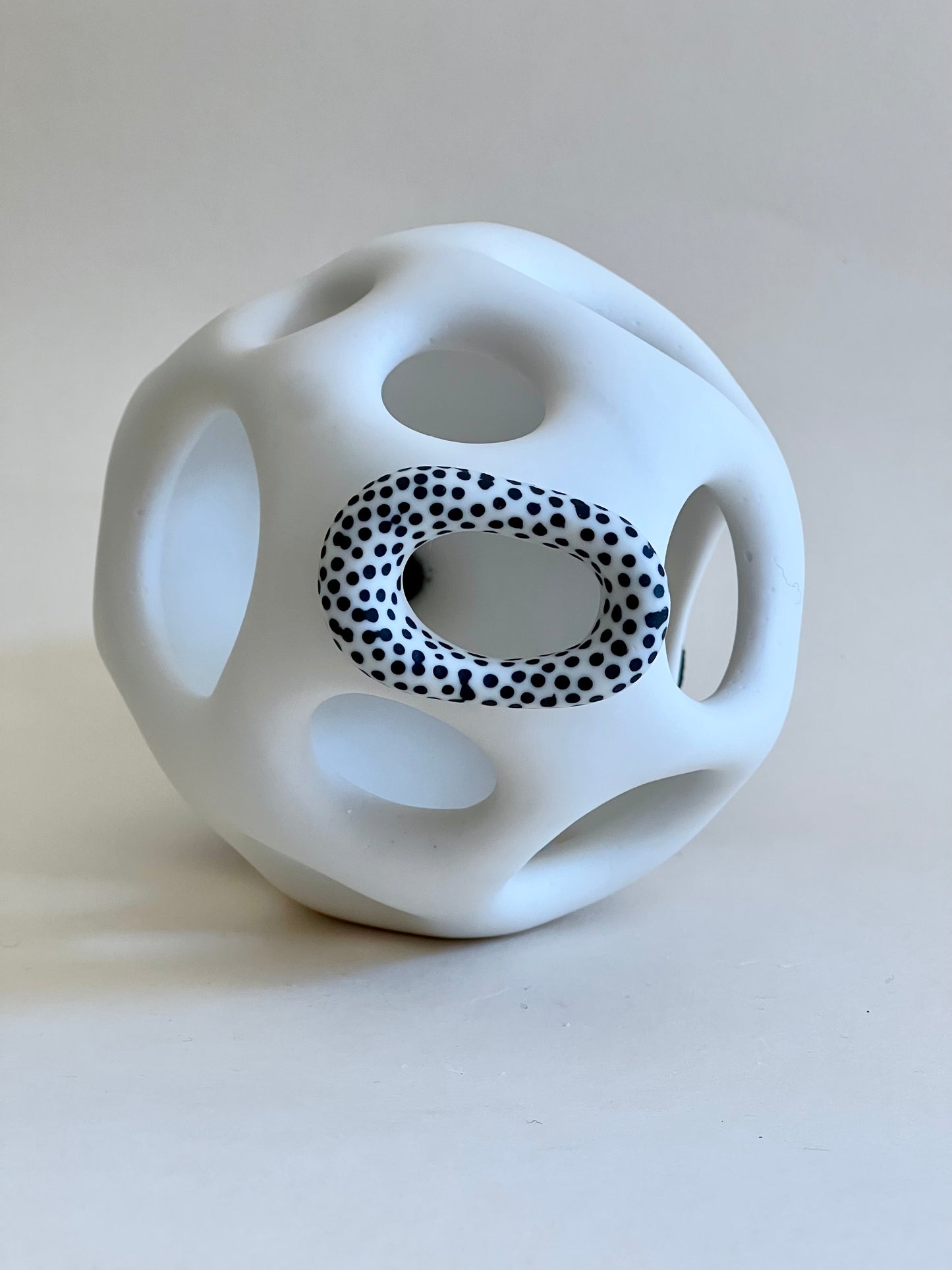 Detail of black porcelain inlay decoration on white porcelain ring.