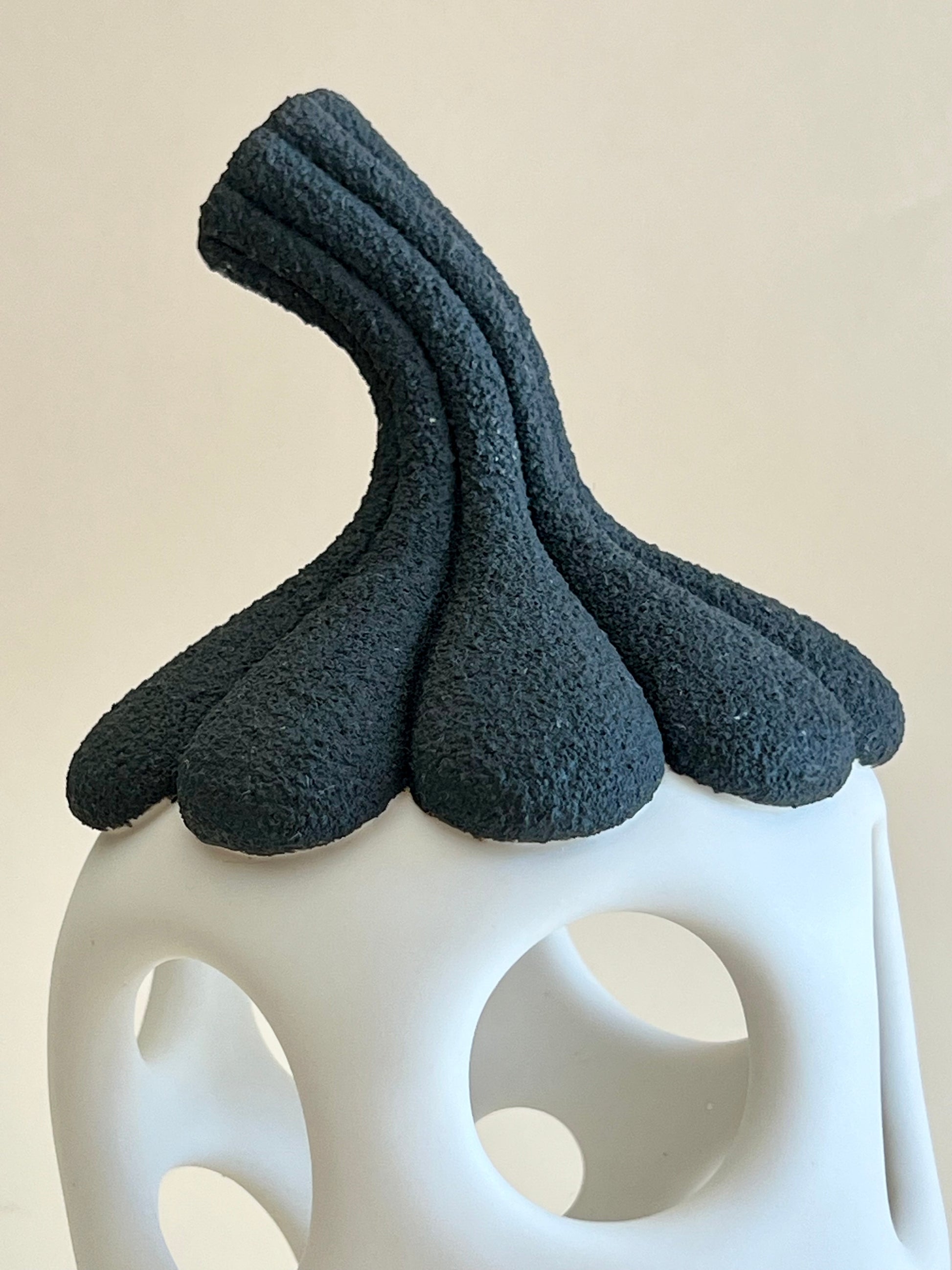 Detail of textured black porcelain contrasting with smooth white porcelain.