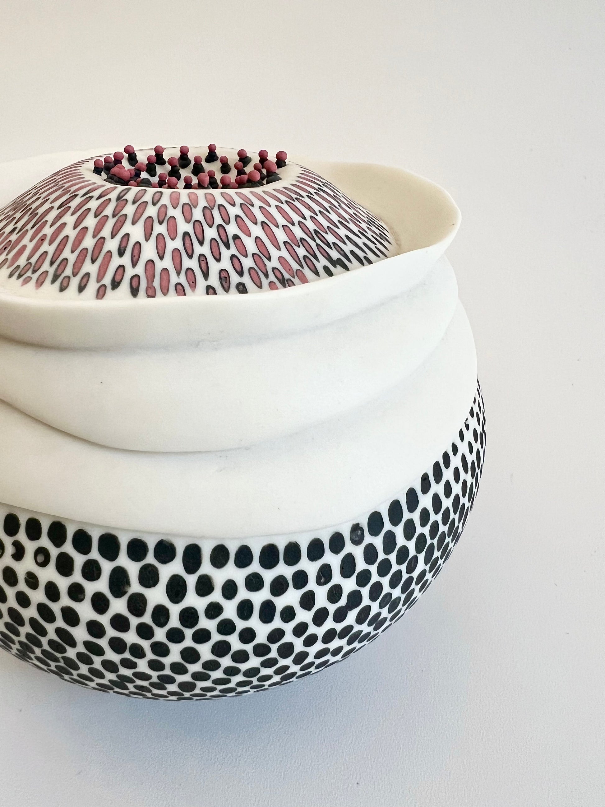 Pulse II handmade porcelain sculpture, side three-quarter view showing the organic rounded form and hand-inlaid surface