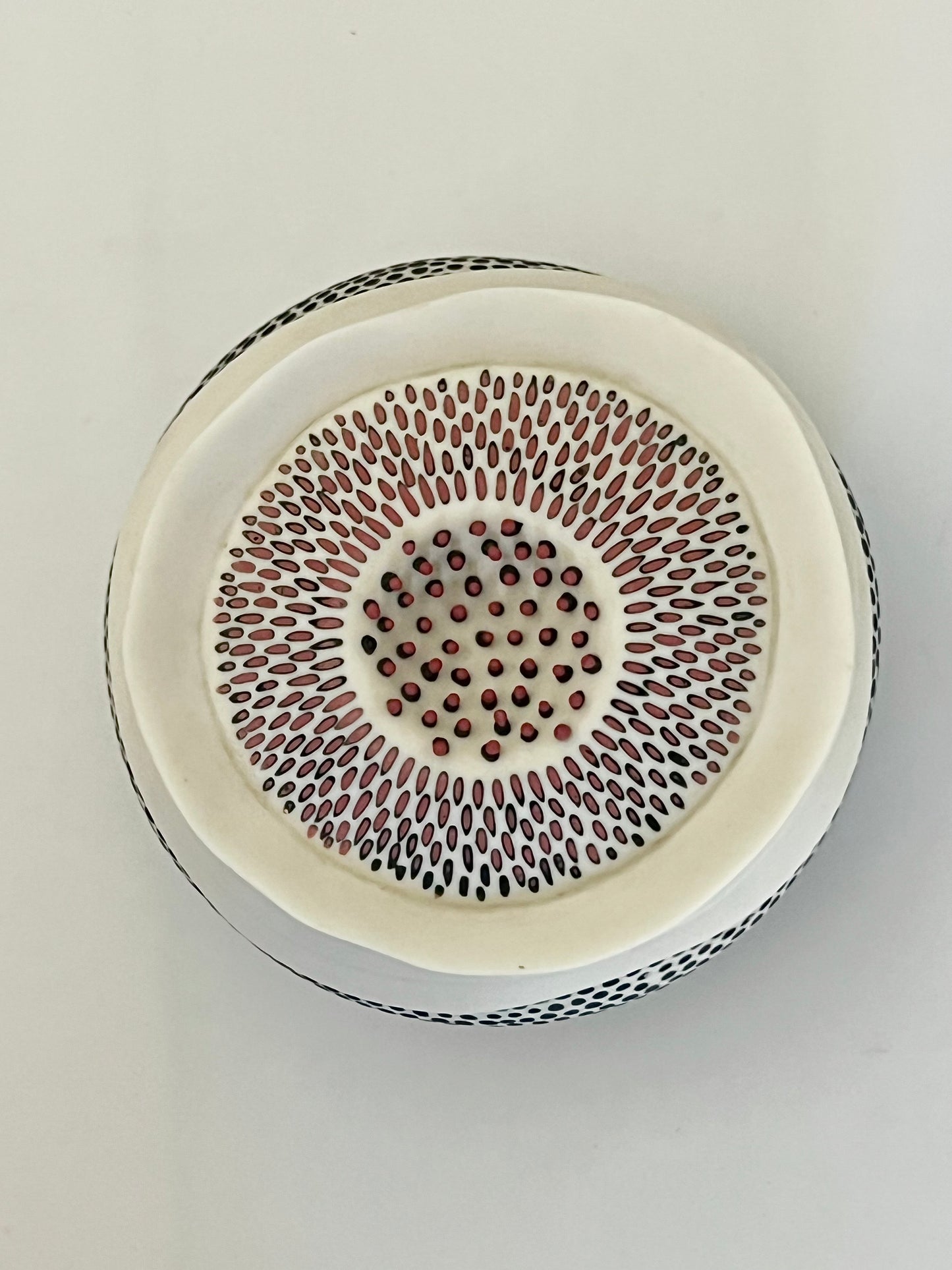 Pulse II porcelain sculpture, top view with red porcelain inlaid details and raised red porcelain elements